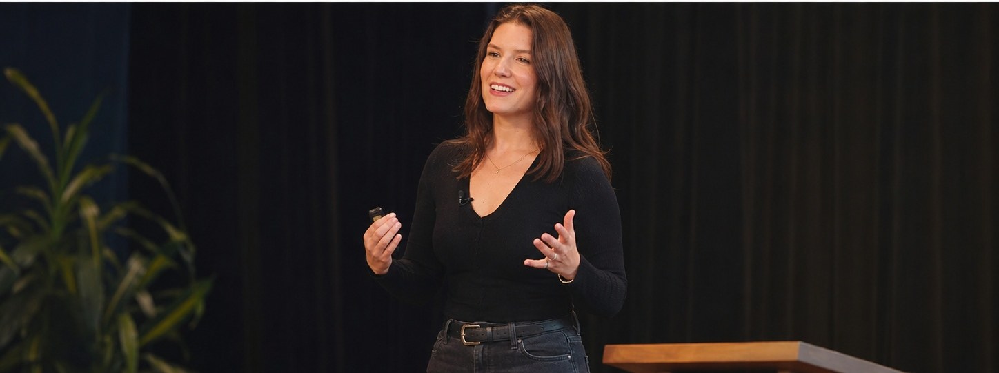 Emili Barbour speaking on stage